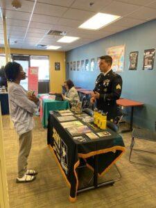 Student standing at Army recruiting booth