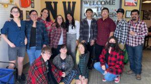 Staff and student group photo, most wearing flannel